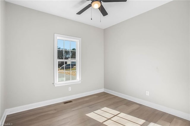 unfurnished room featuring light hardwood / wood-style floors and ceiling fan