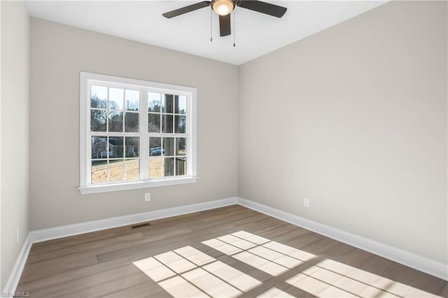 unfurnished room featuring hardwood / wood-style flooring and ceiling fan