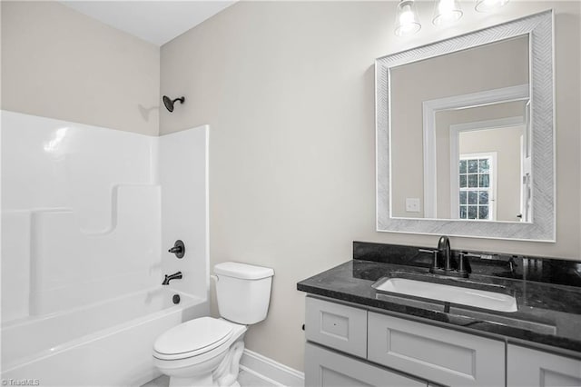 full bathroom with washtub / shower combination, vanity, and toilet