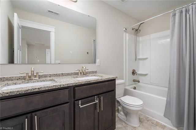 bathroom featuring visible vents, a sink, shower / tub combo, and toilet