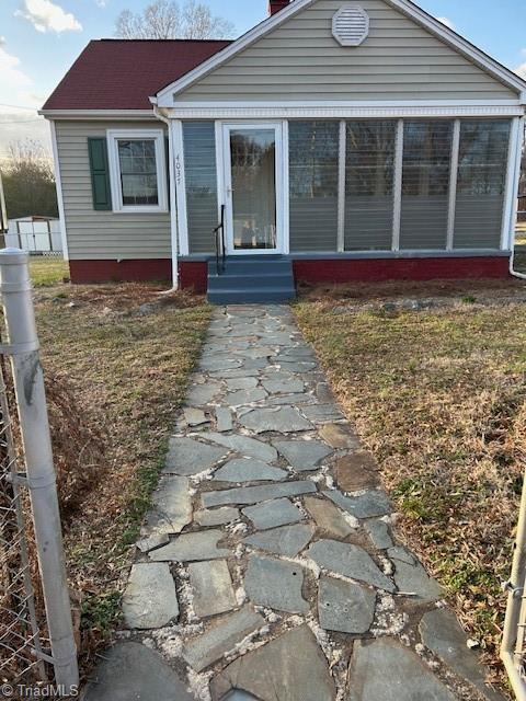 view of front of property with a sunroom