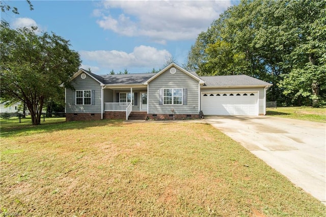 ranch-style house featuring a front yard, a porch, and a garage