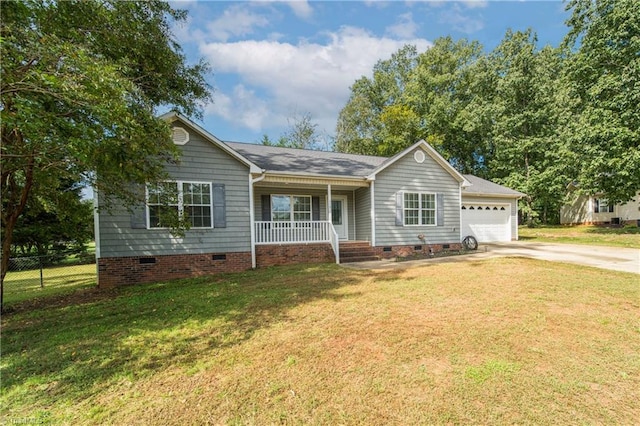 single story home featuring a garage, a front yard, and covered porch