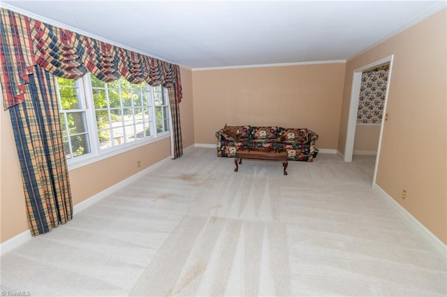 sitting room with light colored carpet and ornamental molding