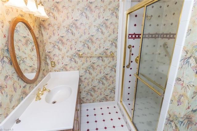 bathroom featuring vanity and a shower with shower door