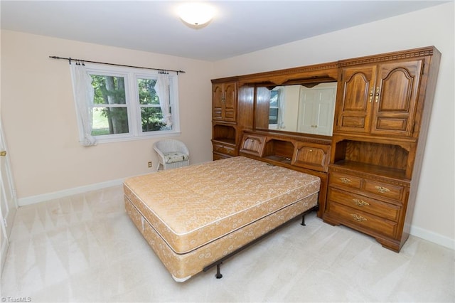 bedroom with light colored carpet