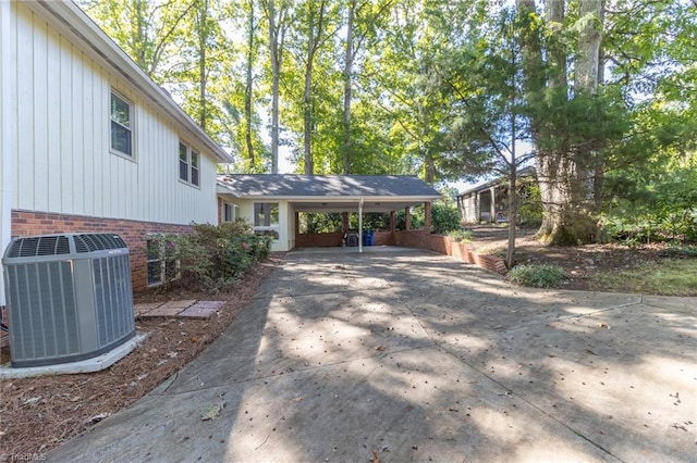 exterior space featuring central AC unit and a carport