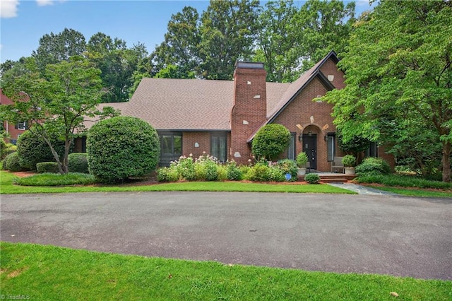 1901 Runnymede Rd, Winston-Salem, NC 27104 - english style home featuring brick siding and a chimney