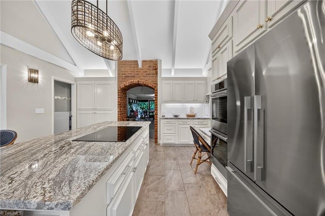 1901 Runnymede Rd, Winston-Salem, NC 27104 - kitchen featuring stainless steel fridge, black electric cooktop, beam ceiling, decorative backsplash, and a center island