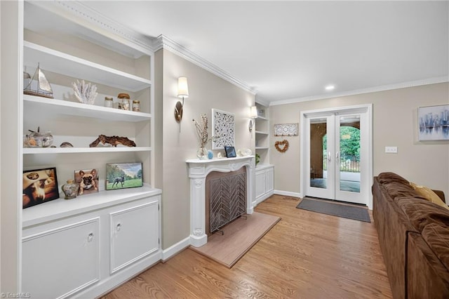 1901 Runnymede Rd, Winston-Salem, NC 27104 - entryway with light wood-type flooring, crown molding, french doors, and a fireplace with raised hearth