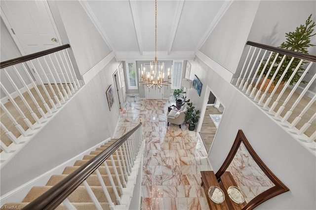1901 Runnymede Rd, Winston-Salem, NC 27104 - stairs featuring marble finish flooring, a chandelier, a fireplace, and beam ceiling