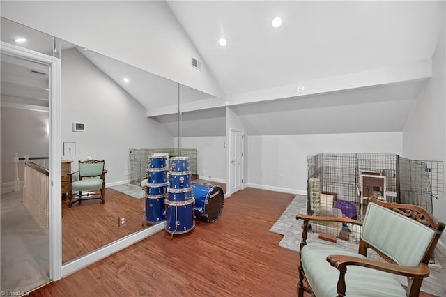 1901 Runnymede Rd, Winston-Salem, NC 27104 - living area featuring lofted ceiling, wood finished floors, and recessed lighting