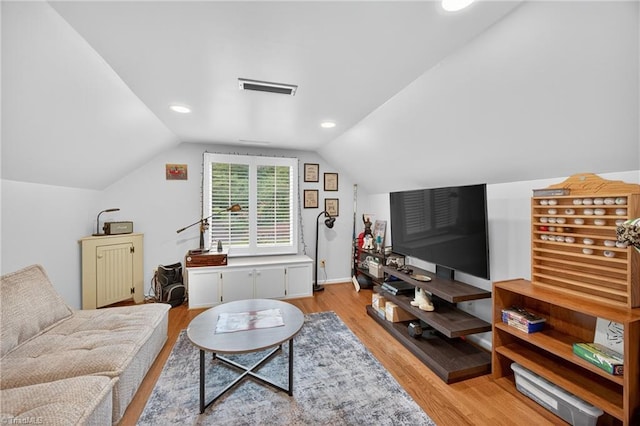 1901 Runnymede Rd, Winston-Salem, NC 27104 - living room with light wood finished floors, vaulted ceiling, and recessed lighting