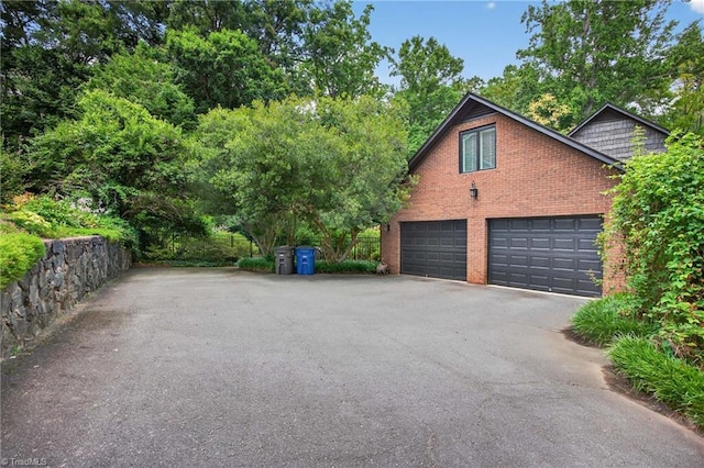 1901 Runnymede Rd, Winston-Salem, NC 27104 - view of property exterior featuring brick siding and driveway