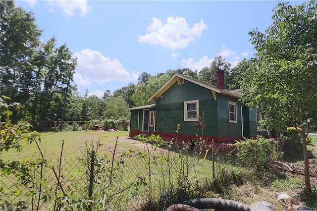 view of property exterior featuring a lawn