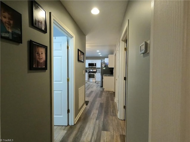 hall featuring dark wood-type flooring