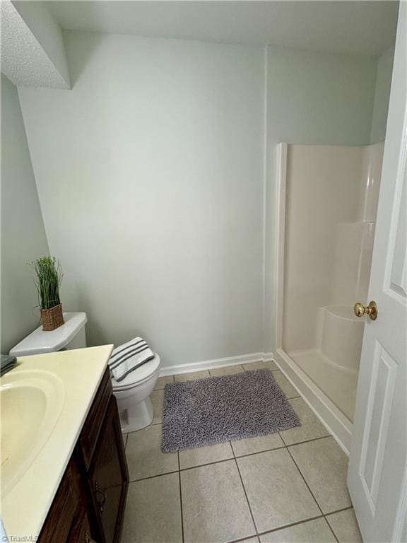733 Rivertree Ln, Winston-Salem, NC 27103 - bathroom with vanity, tile patterned flooring, toilet, and a shower