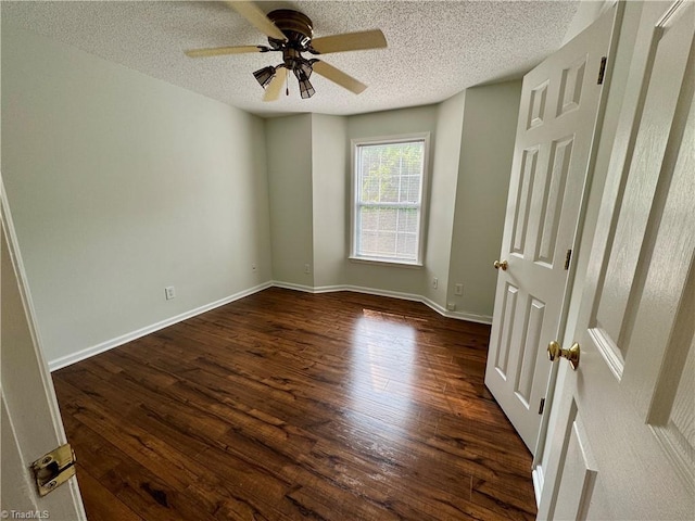 733 Rivertree Ln, Winston-Salem, NC 27103 - spare room featuring dark wood-type flooring, ceiling fan, a textured ceiling, and baseboards