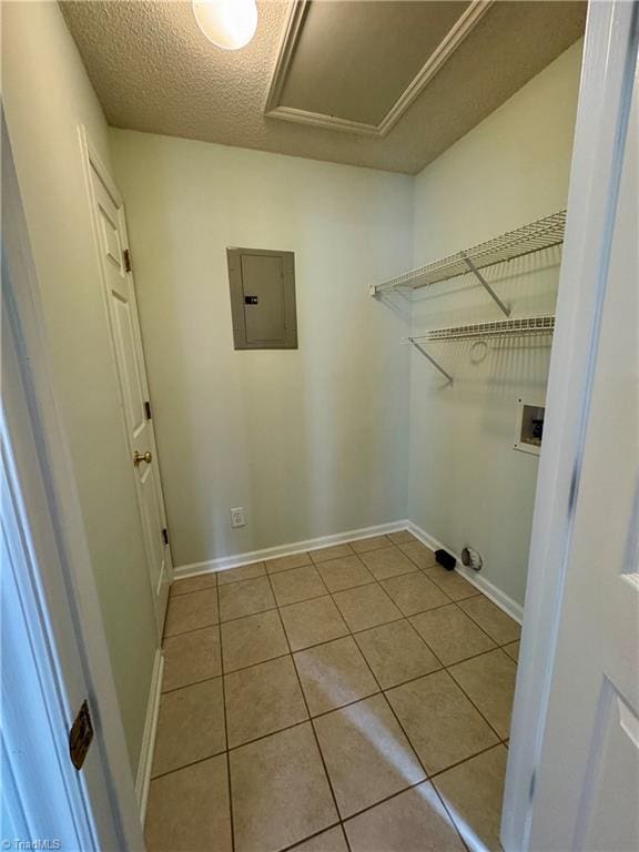 733 Rivertree Ln, Winston-Salem, NC 27103 - washroom featuring electric panel, hookup for a washing machine, tile patterned floors, baseboards, and a textured ceiling