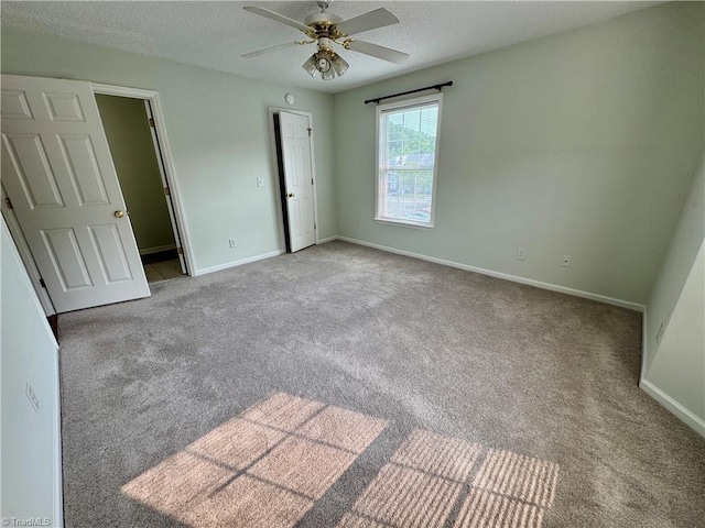 733 Rivertree Ln, Winston-Salem, NC 27103 - unfurnished bedroom with carpet floors, a textured ceiling, baseboards, and ceiling fan