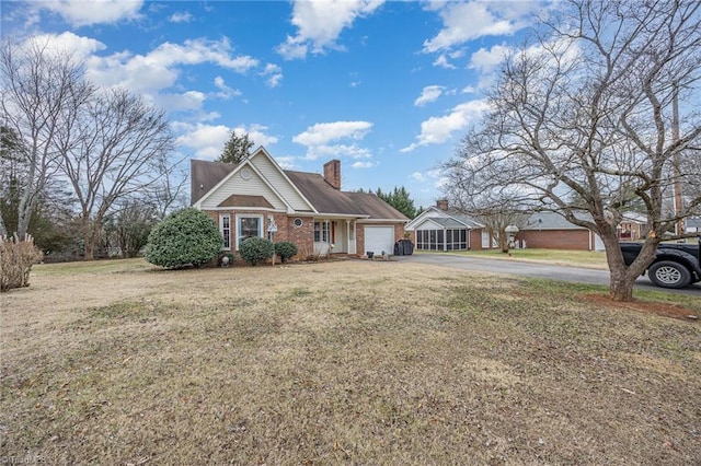 view of front of property with a garage and a front lawn