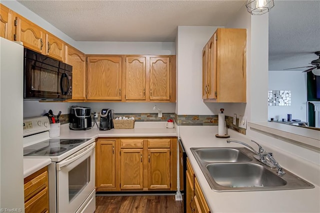 kitchen featuring white range with electric cooktop, sink, a textured ceiling, stainless steel fridge, and ceiling fan