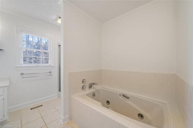 bathroom with tile patterned flooring, crown molding, a relaxing tiled tub, and vanity