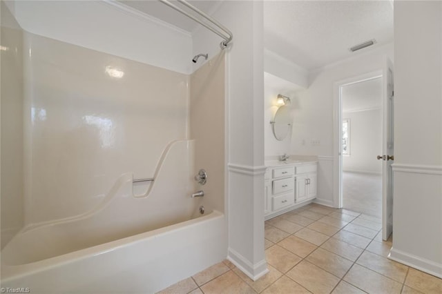 bathroom featuring ornamental molding,  shower combination, tile patterned flooring, and vanity