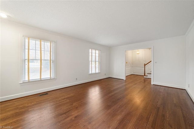 unfurnished room featuring dark hardwood / wood-style floors