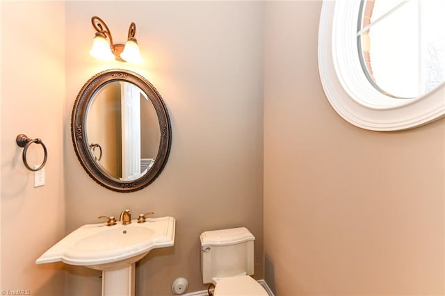 bathroom with toilet and sink