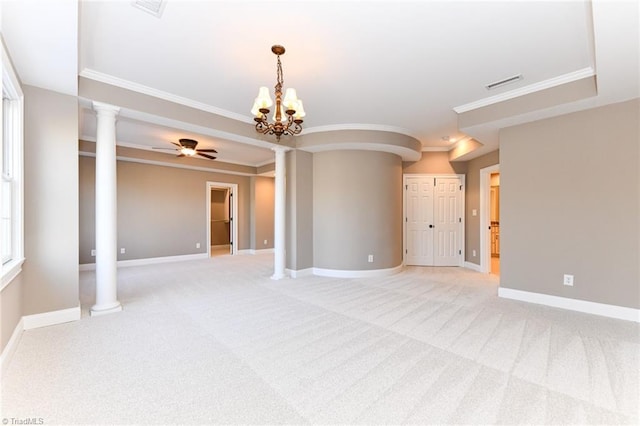 spare room featuring light carpet, ornamental molding, and decorative columns