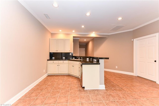 kitchen featuring decorative backsplash, sink, ornamental molding, kitchen peninsula, and light tile patterned floors