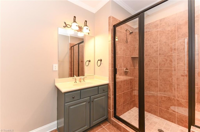 bathroom with vanity, a shower with door, and crown molding