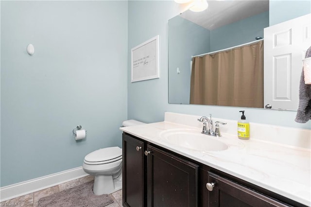 full bathroom featuring baseboards, tile patterned flooring, toilet, and vanity