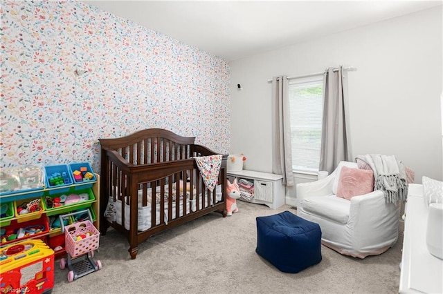 bedroom with wallpapered walls and carpet