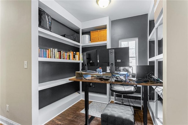 office area with built in study area and wood finished floors