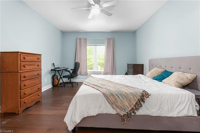 bedroom with baseboards, ceiling fan, and wood finished floors