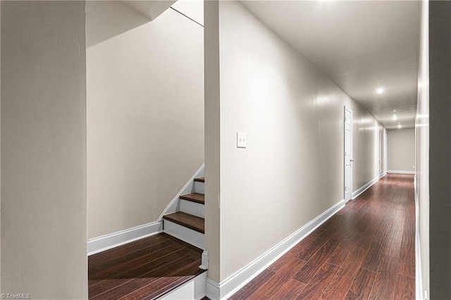 hall featuring stairs, recessed lighting, baseboards, and wood finished floors