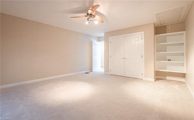 unfurnished bedroom featuring ceiling fan, light carpet, and a closet