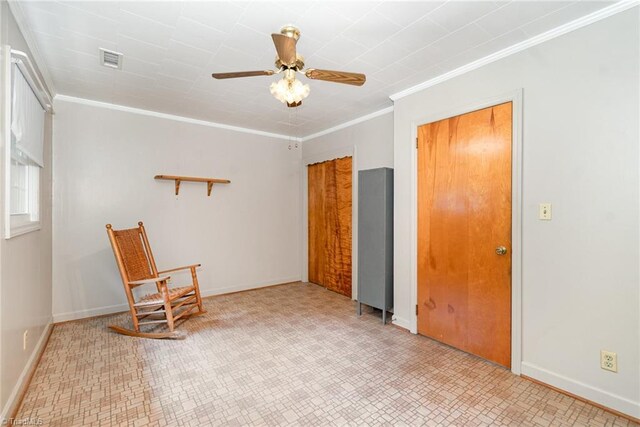 unfurnished room with ceiling fan, crown molding, baseboards, and light floors