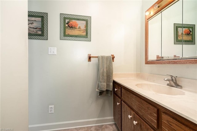 bathroom with baseboards and vanity