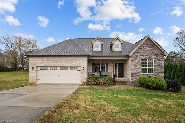 view of front of home with a porch, a garage, and a front yard