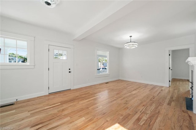 foyer entrance with light hardwood / wood-style flooring