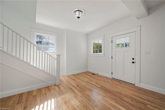 entryway featuring light hardwood / wood-style flooring and a healthy amount of sunlight