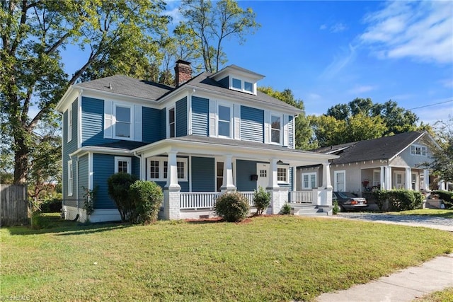 view of front facade with a porch and a front yard