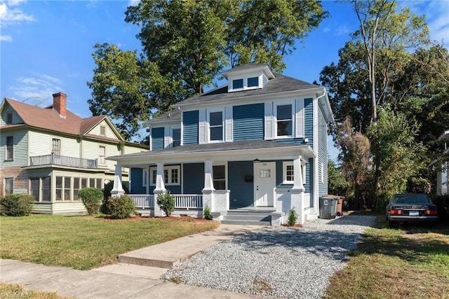 view of front of property with a front lawn and covered porch