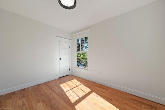 spare room with light hardwood / wood-style floors