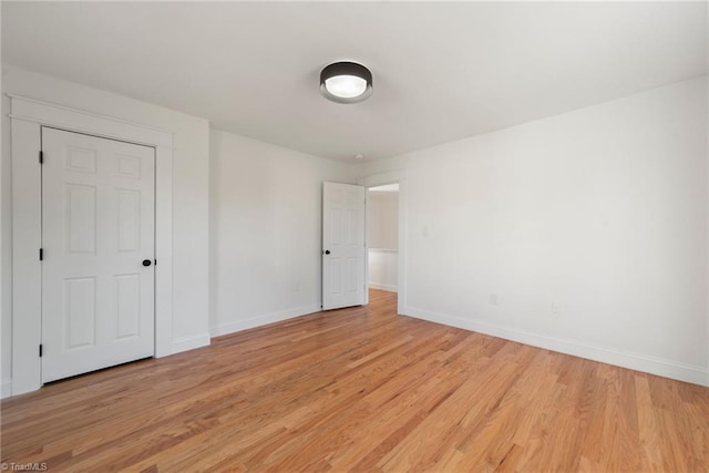 spare room featuring light hardwood / wood-style floors