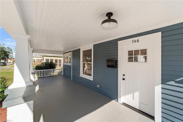 view of patio featuring a porch