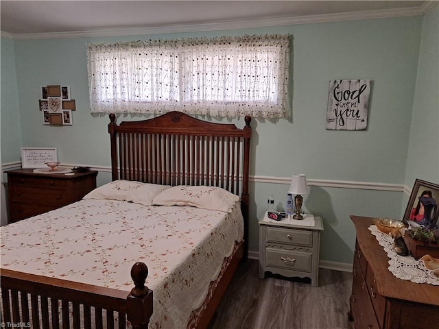 bedroom with multiple windows, crown molding, and dark hardwood / wood-style floors